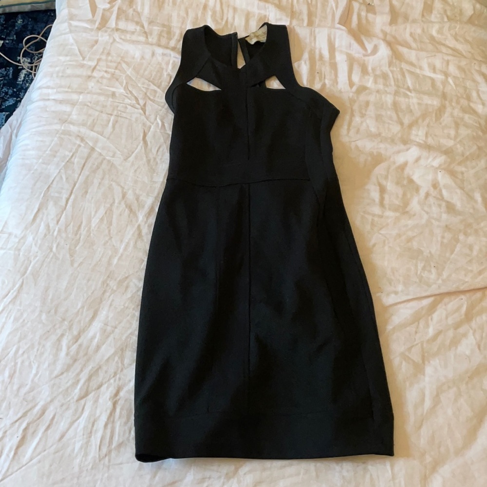 Black stretch cocktail dress with cut outs